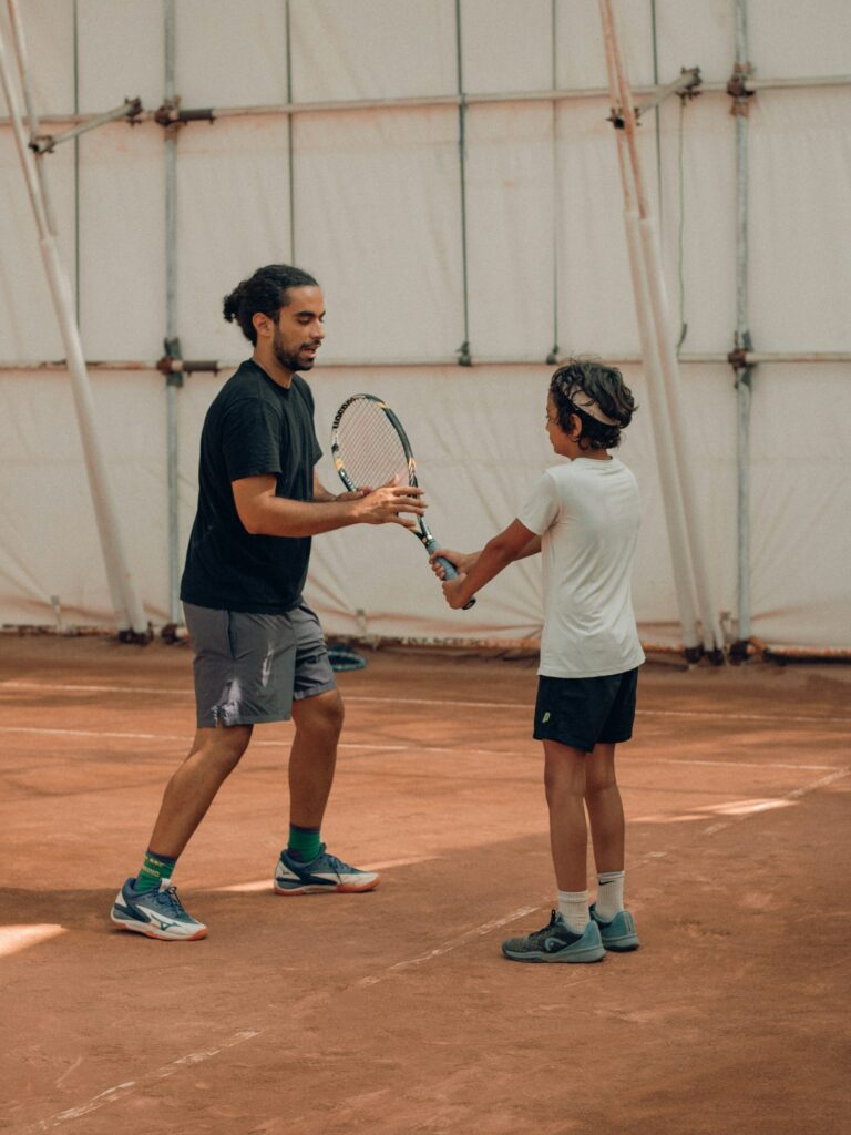 Coaching session with a ball basket and cones